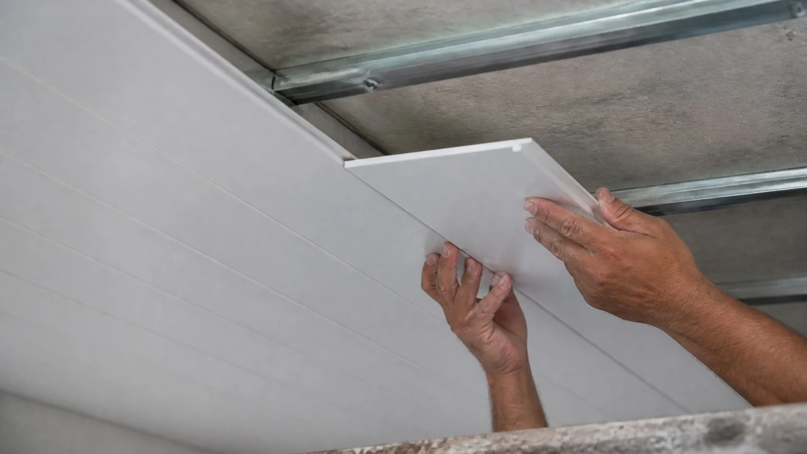 PVC ceiling panels installation on metal battens